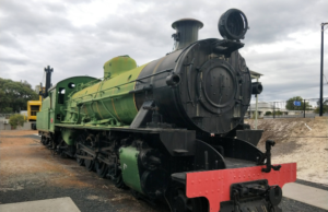 Green and black steam train