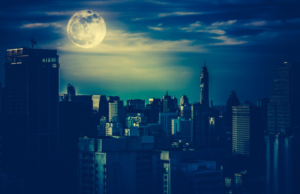 Cityscape with a full moon